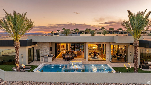 2867 East Granite Way St. George, UT 84790 - Photo 68 of 69 Modern exterior with a rectangular pool featuring integrated fire features and a spa