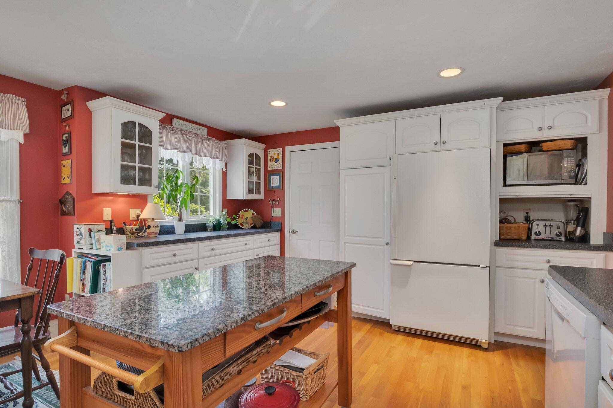 107 Clipper Way Brewster, MA 02631 - Photo 14 of 60 a kitchen with stainless steel appliances granite countertop a refrigerator and a stove