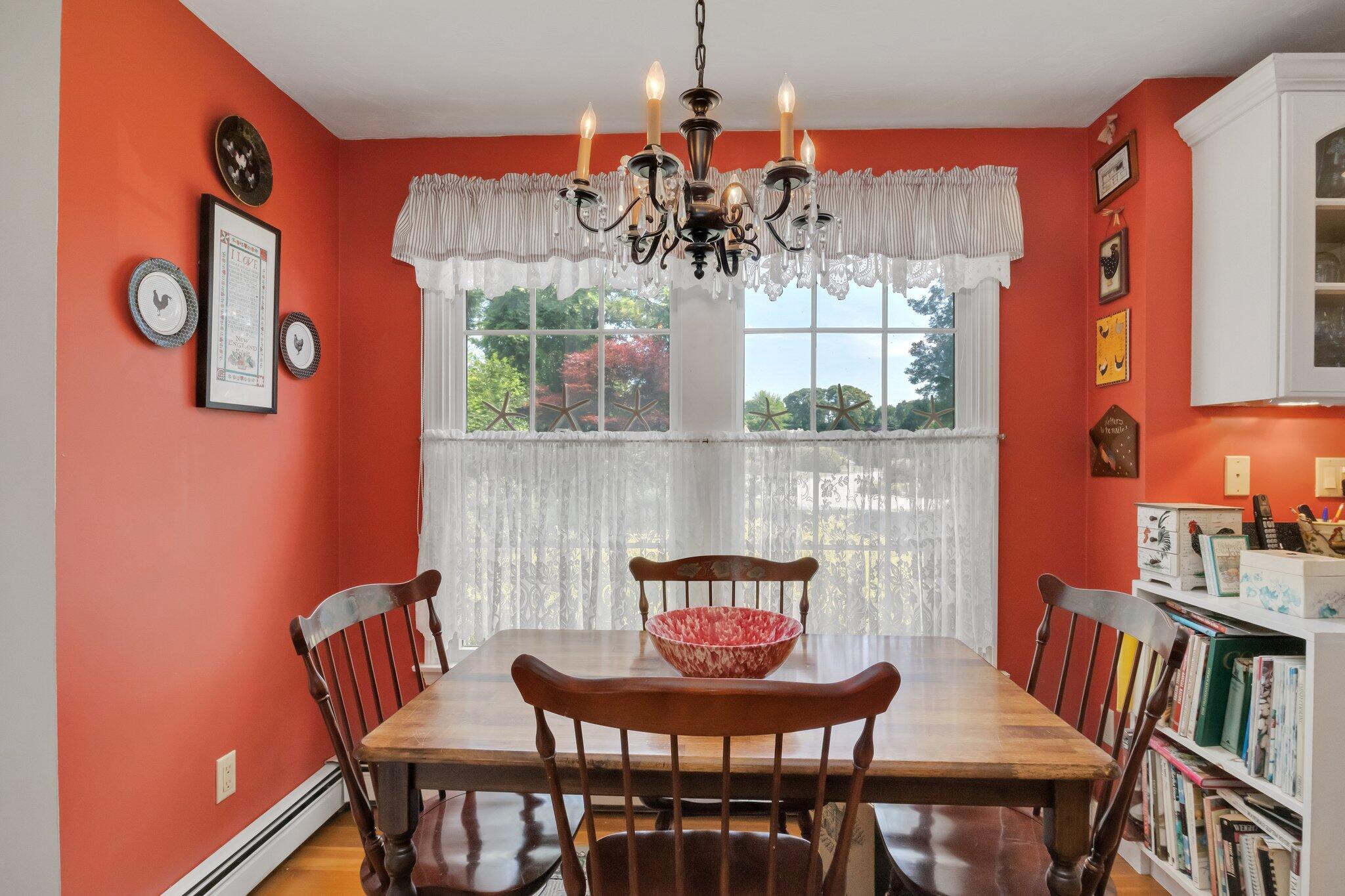 107 Clipper Way Brewster, MA 02631 - Photo 16 of 60 a view of a dining room with furniture window and wooden floor