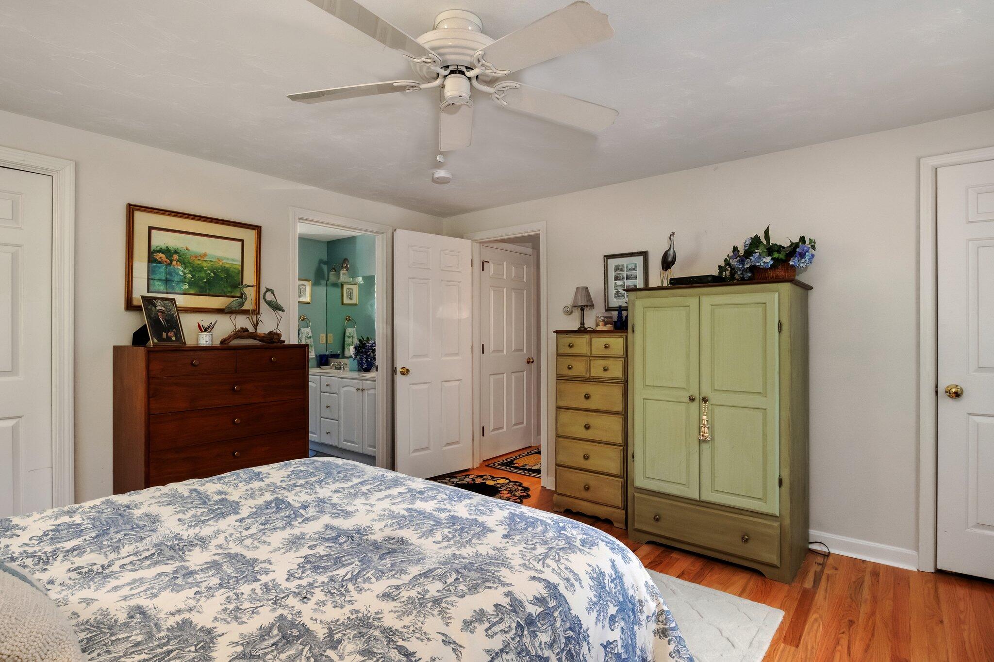 107 Clipper Way Brewster, MA 02631 - Photo 19 of 60 a bedroom with a bed and furniture