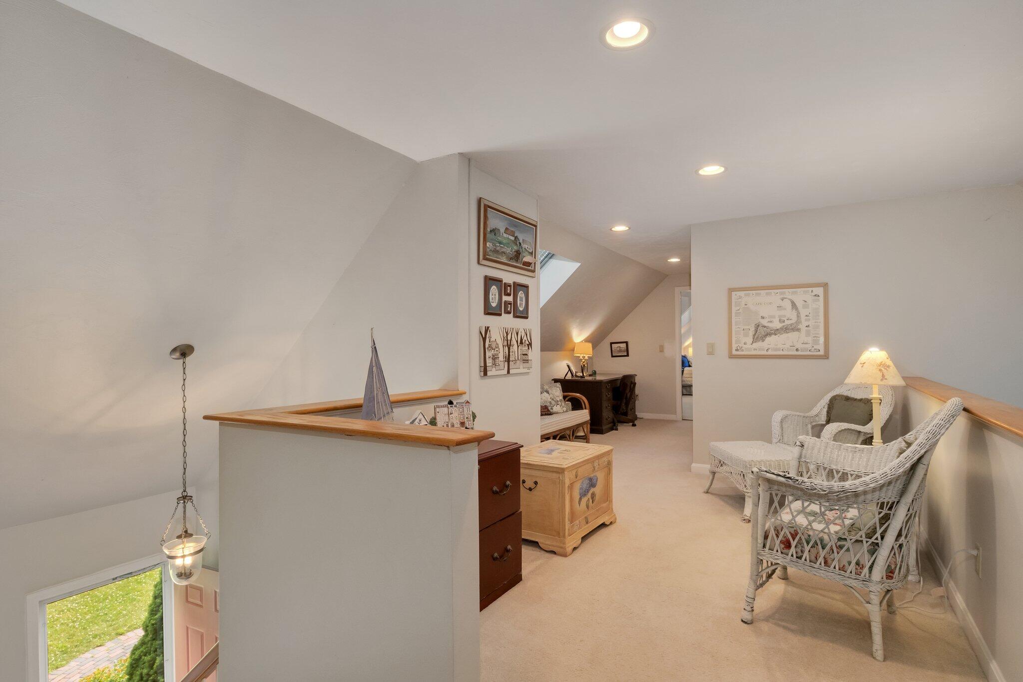 107 Clipper Way Brewster, MA 02631 - Photo 26 of 60 a living room with furniture and a table