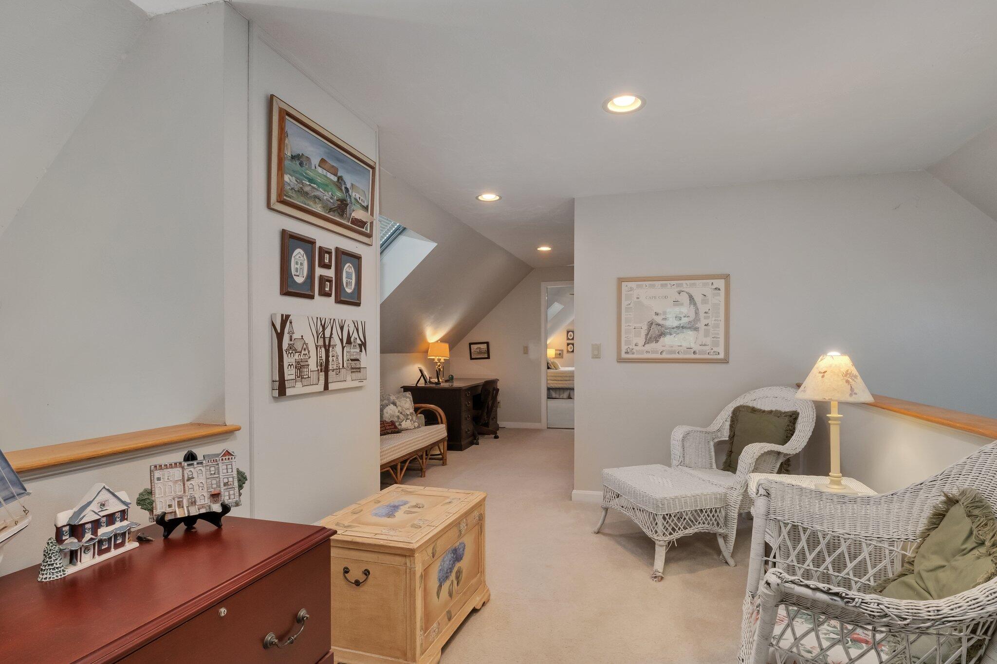 107 Clipper Way Brewster, MA 02631 - Photo 27 of 60 a living room with furniture and a table