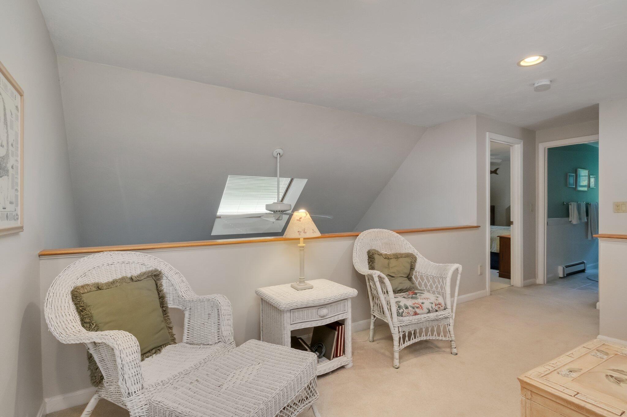 107 Clipper Way Brewster, MA 02631 - Photo 28 of 60 a living room with furniture and a table