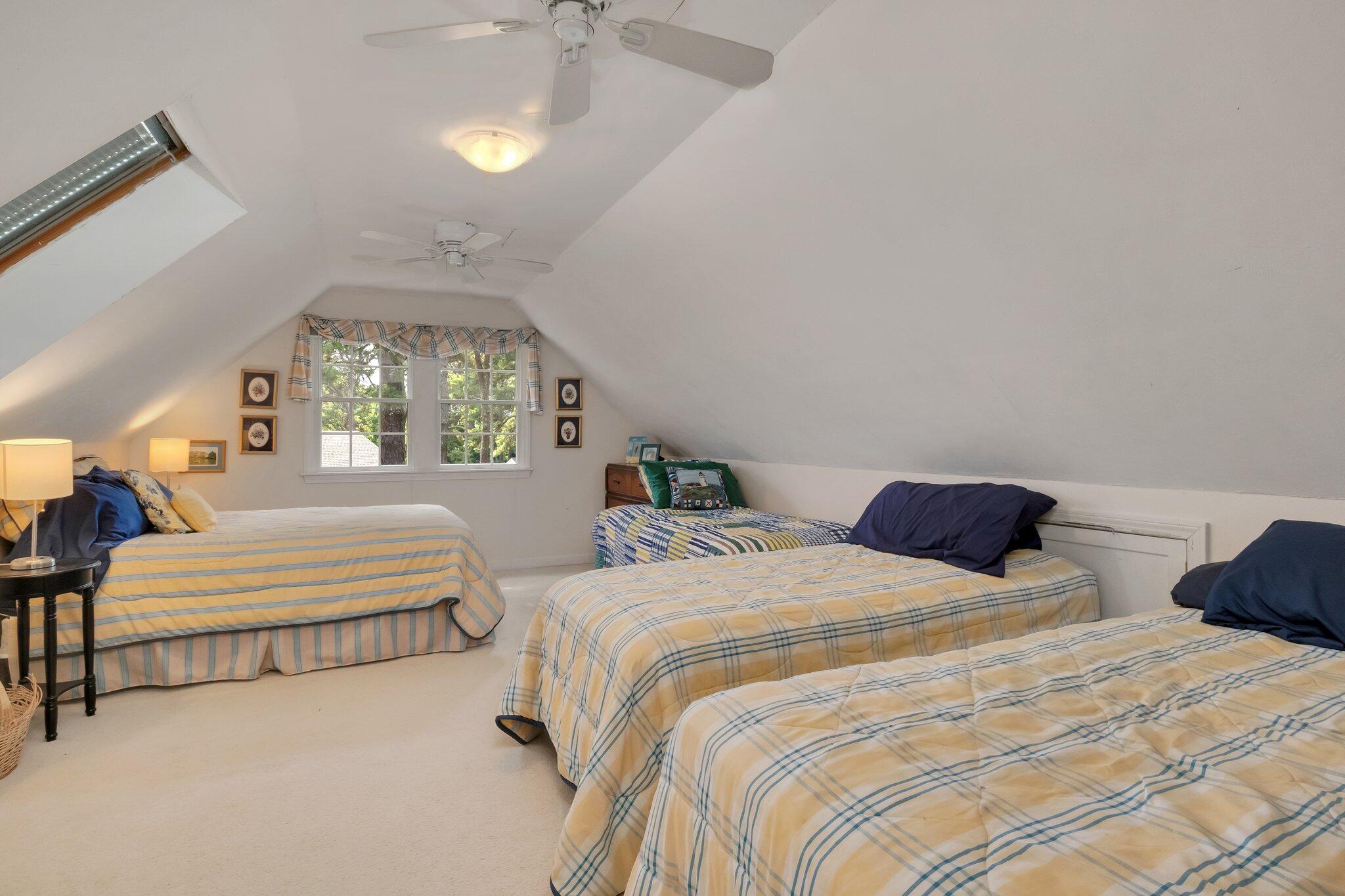 107 Clipper Way Brewster, MA 02631 - Photo 30 of 60 a bedroom with bed and window