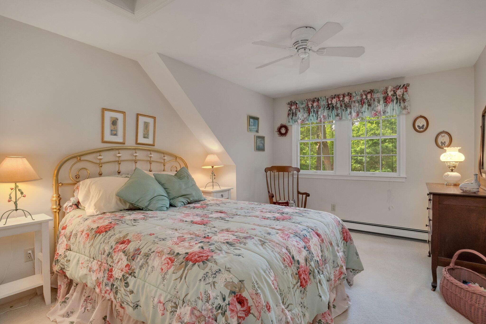 107 Clipper Way Brewster, MA 02631 - Photo 32 of 60 a bedroom with a bed and a window