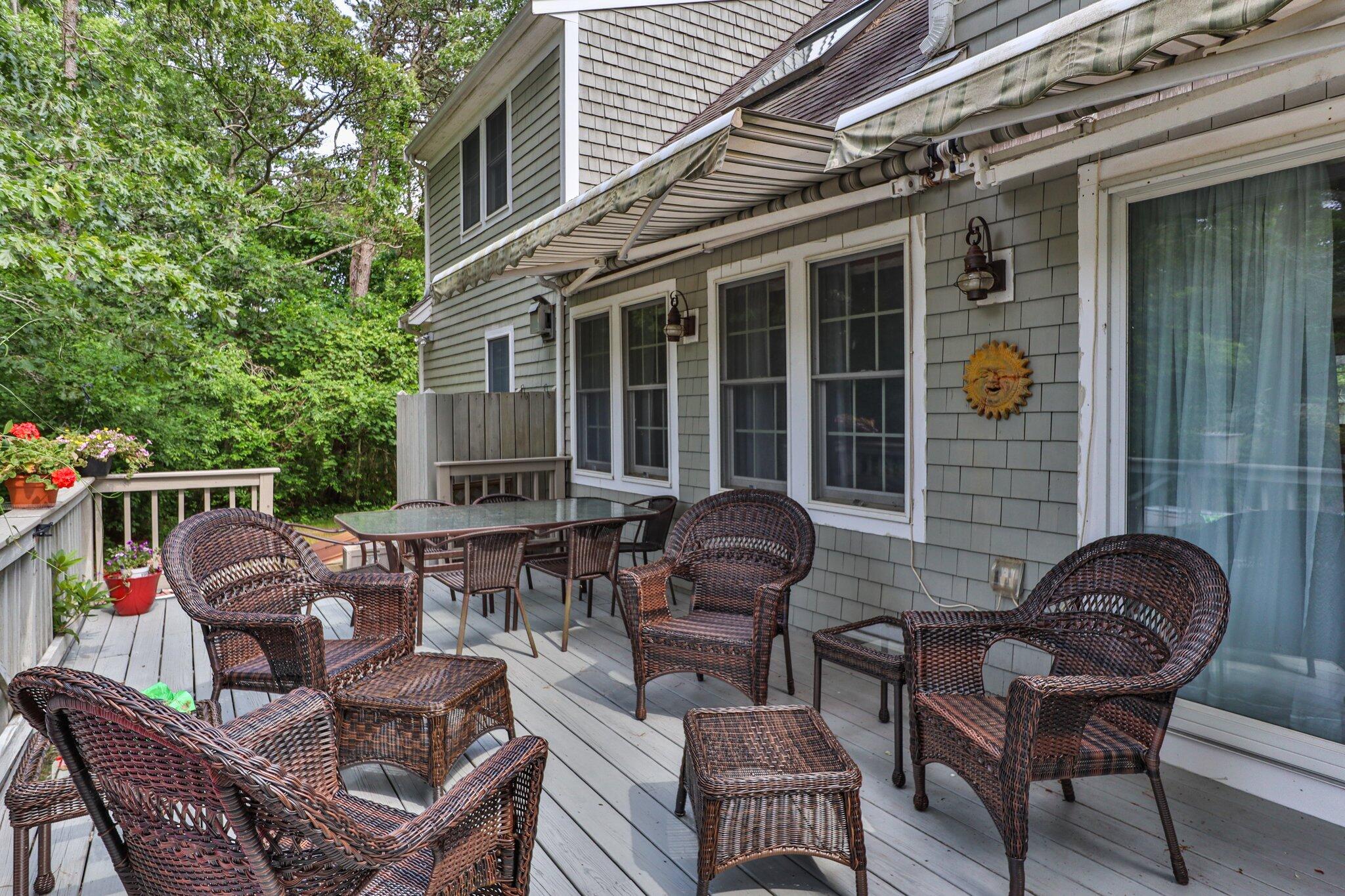 107 Clipper Way Brewster, MA 02631 - Photo 42 of 60 a backyard of a house with outdoor seating