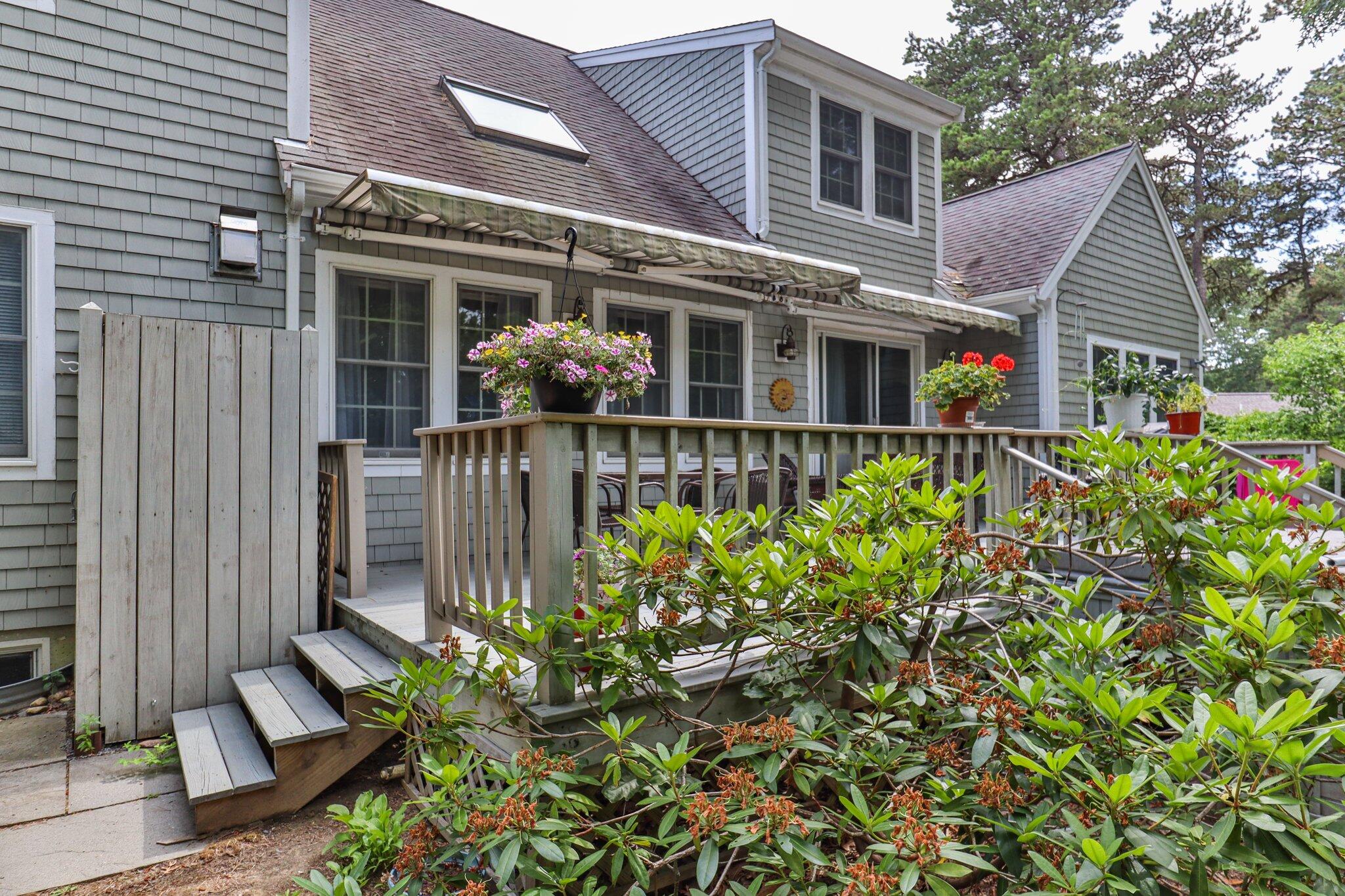 107 Clipper Way Brewster, MA 02631 - Photo 43 of 60 a front view of a house with garden