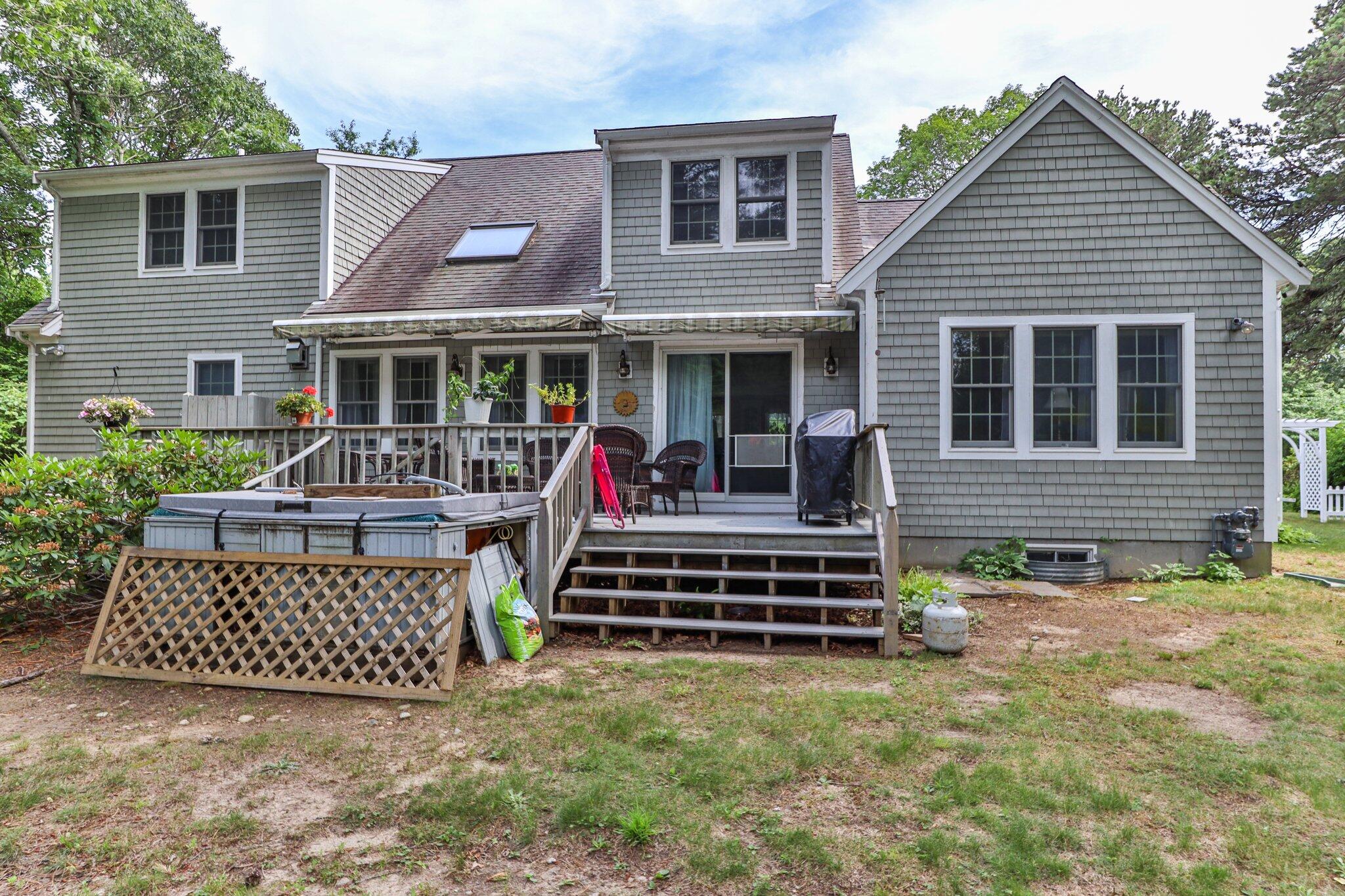 107 Clipper Way Brewster, MA 02631 - Photo 44 of 60 a view of a house with a backyard and porch