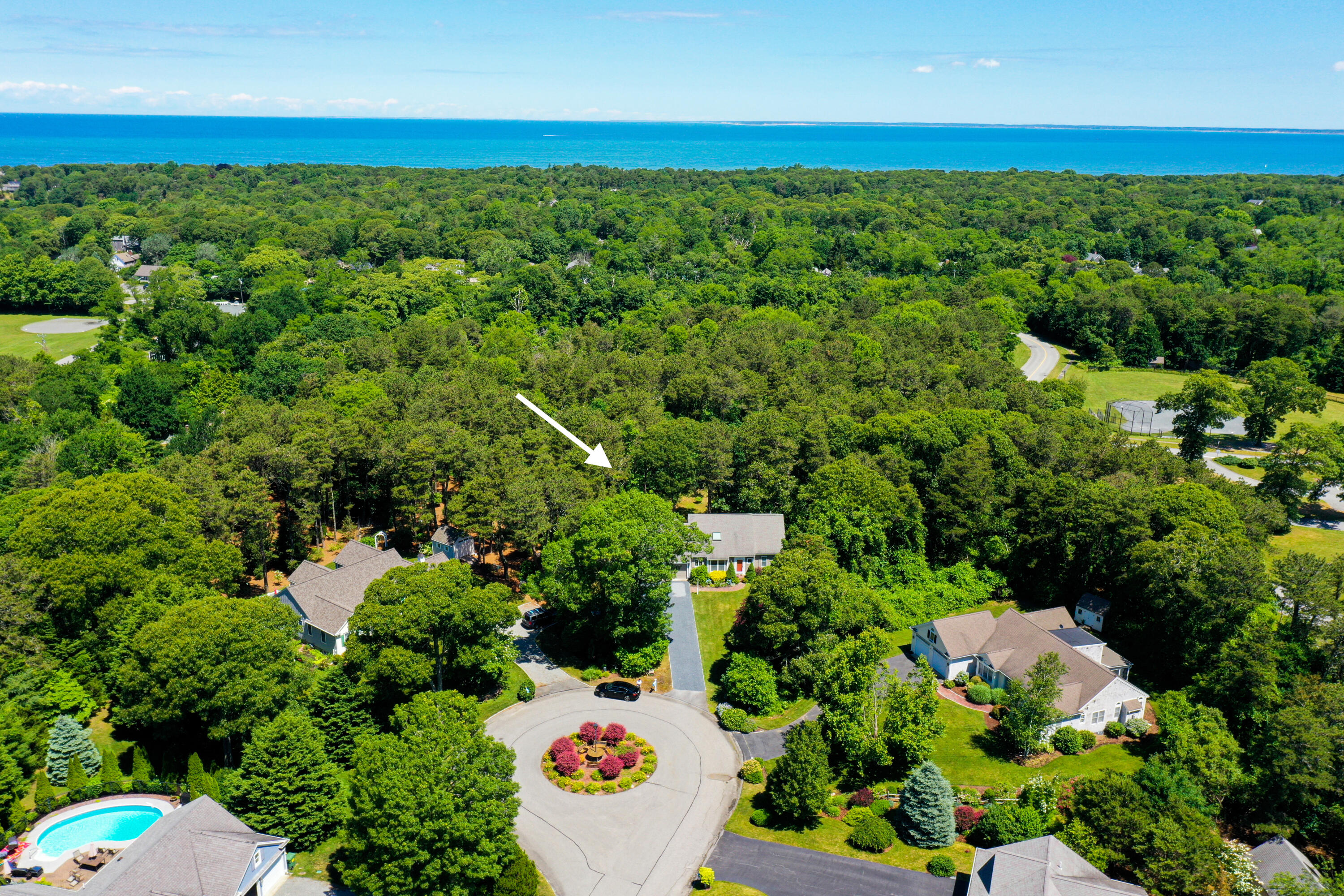 107 Clipper Way Brewster, MA 02631 - Photo 46 of 60 a view of a garden with a flower garden