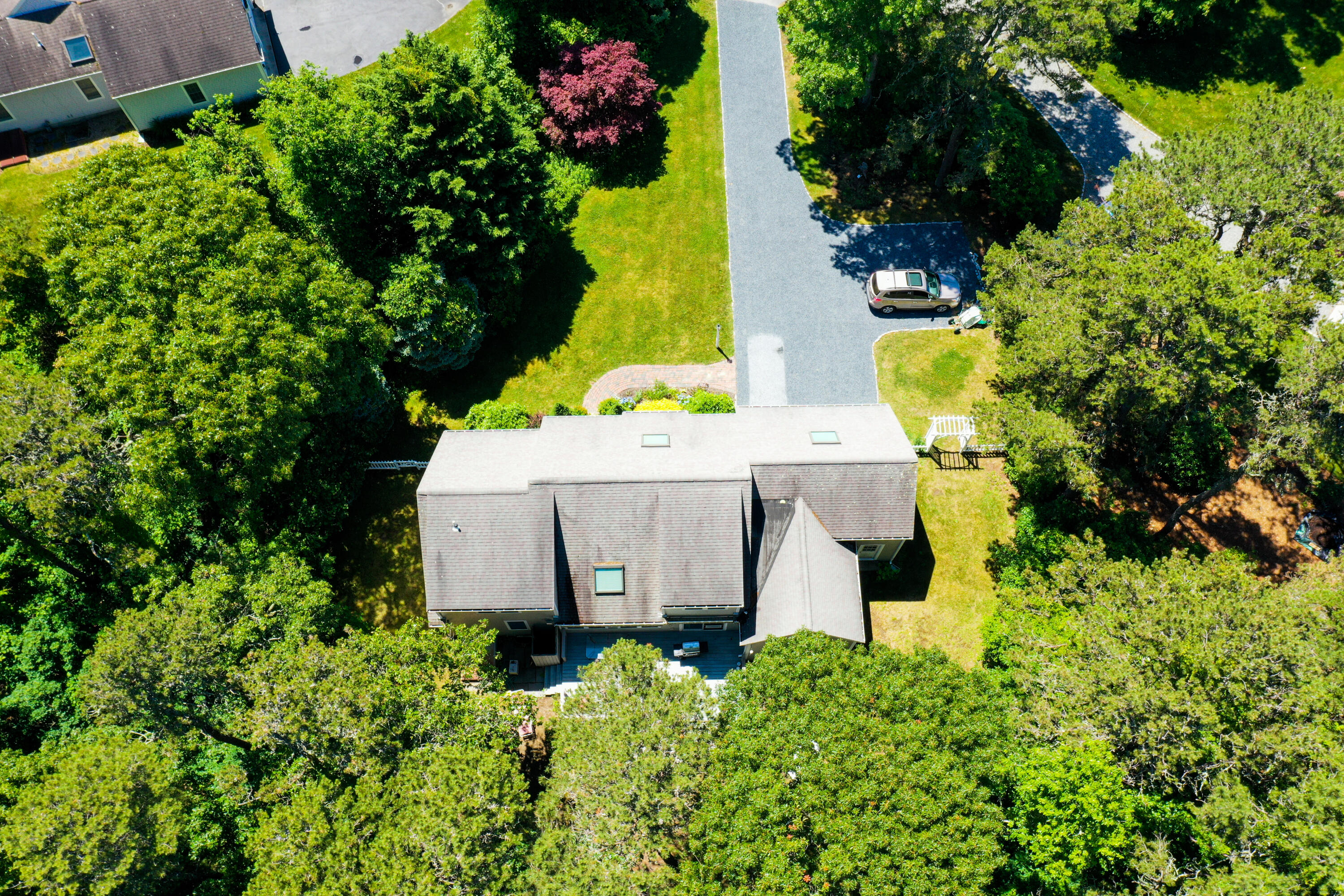 107 Clipper Way Brewster, MA 02631 - Photo 49 of 60 an aerial view of a house with a yard and garden