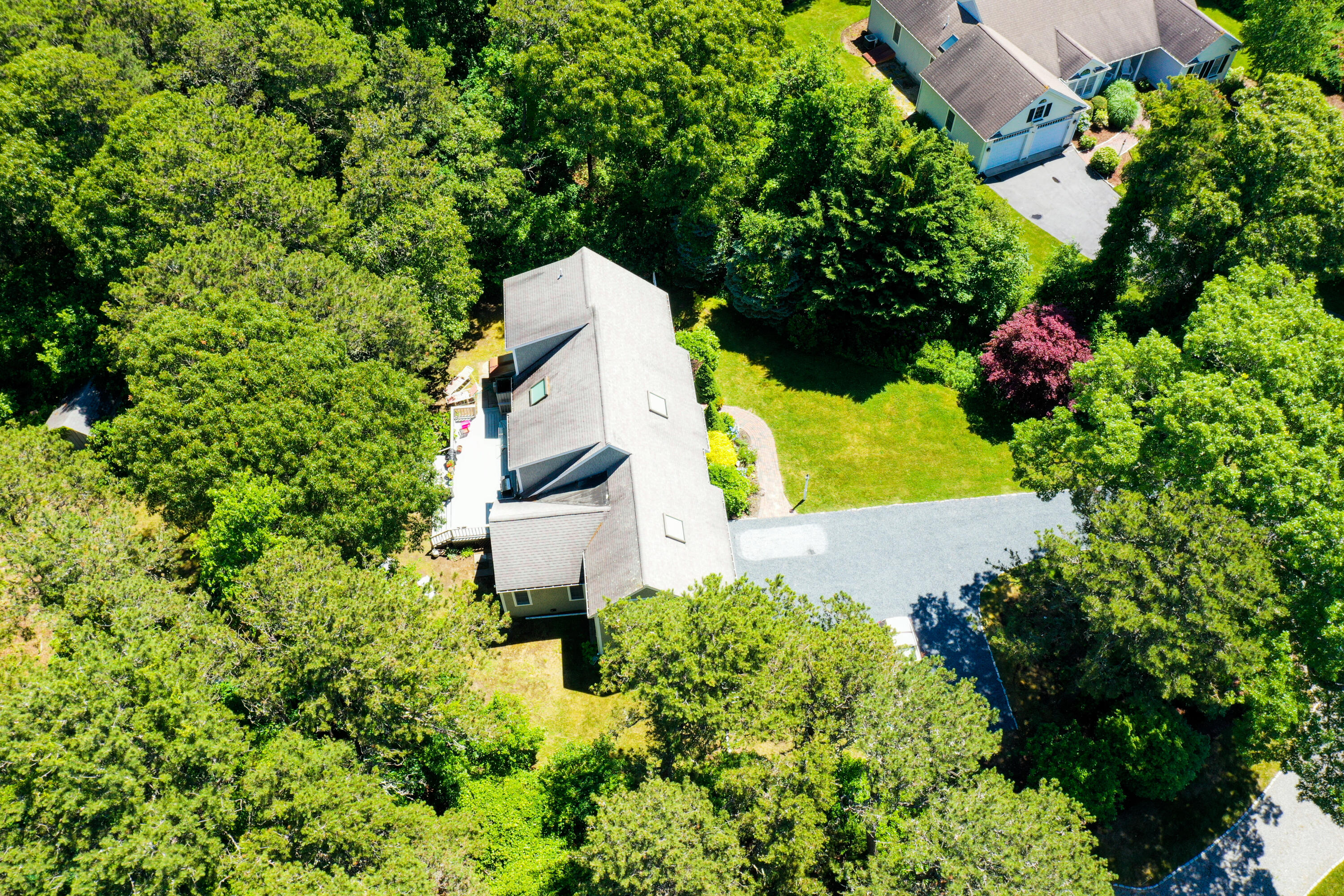 107 Clipper Way Brewster, MA 02631 - Photo 50 of 60 an aerial view of a house with a yard and garden
