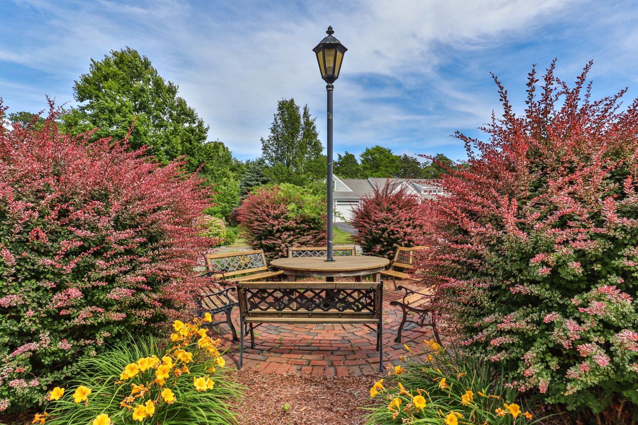107 Clipper Way Brewster, MA 02631 - Photo 53 of 60 a sign board with a house in the background