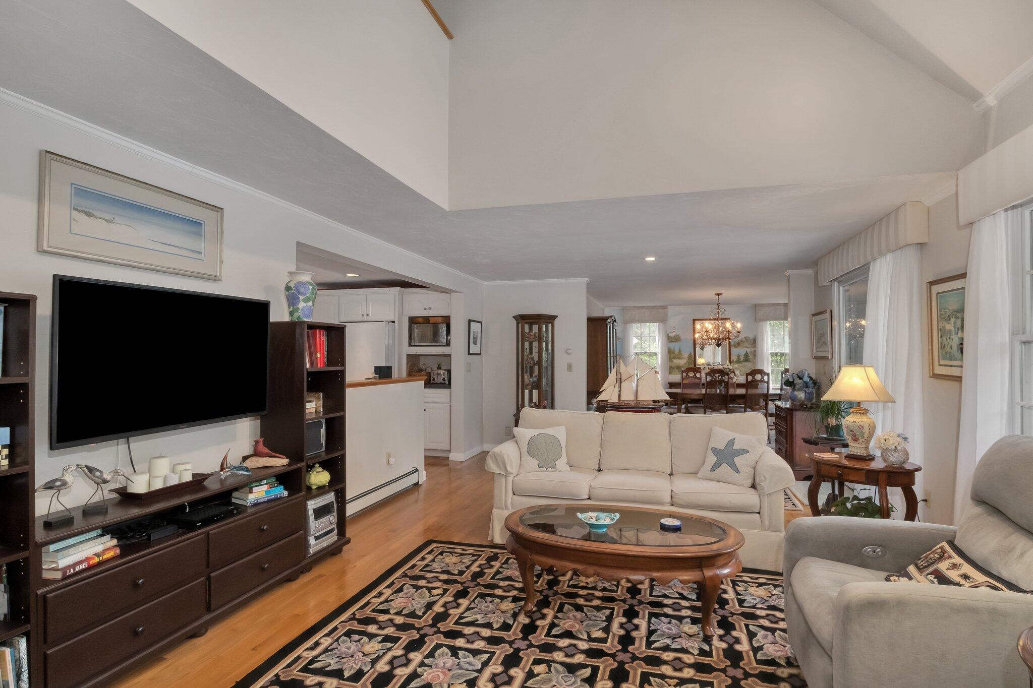 107 Clipper Way Brewster, MA 02631 - Photo 8 of 60 a living room with furniture and a flat screen tv