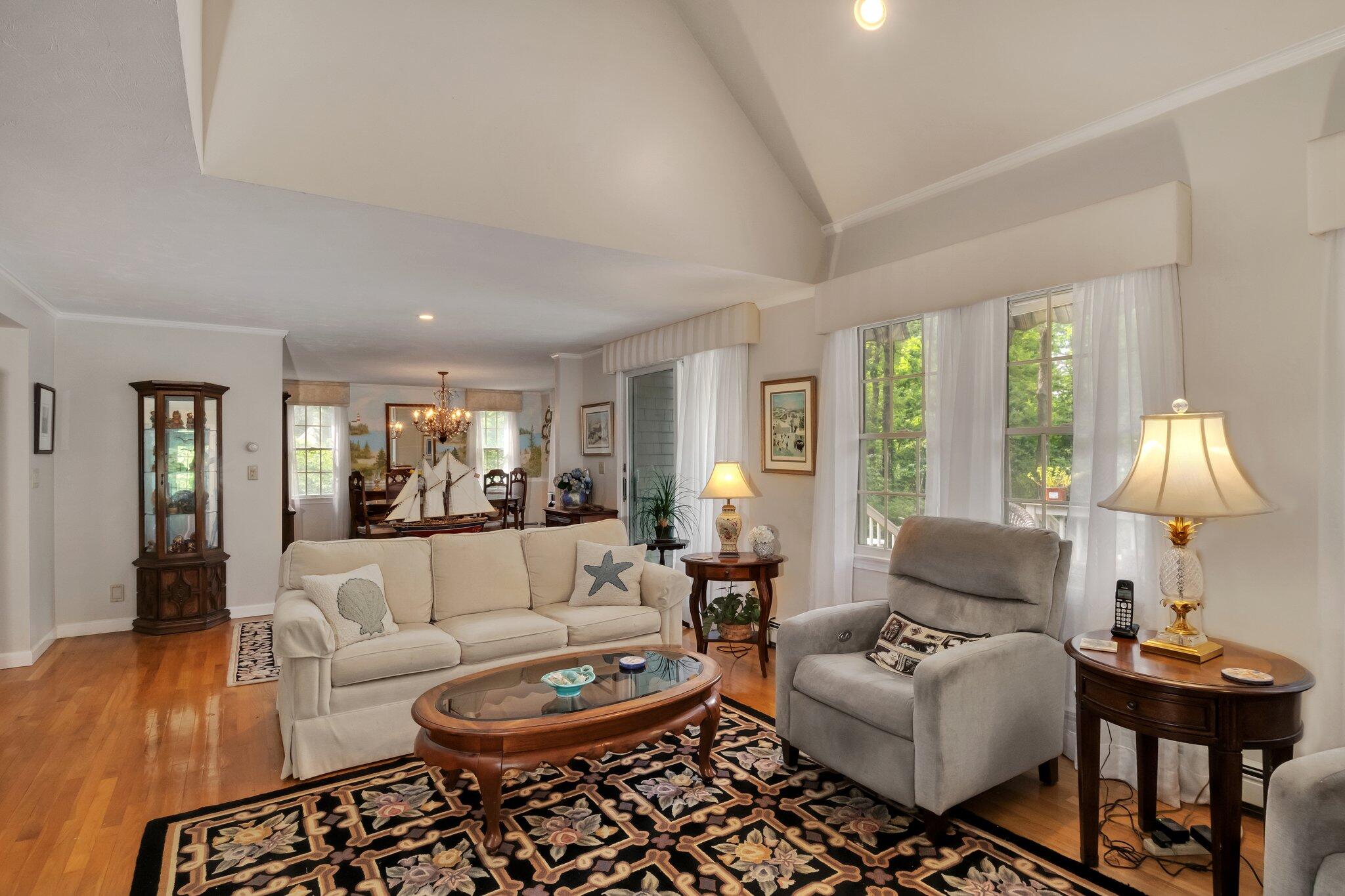 107 Clipper Way Brewster, MA 02631 - Photo 9 of 60 a living room with furniture and a lamp