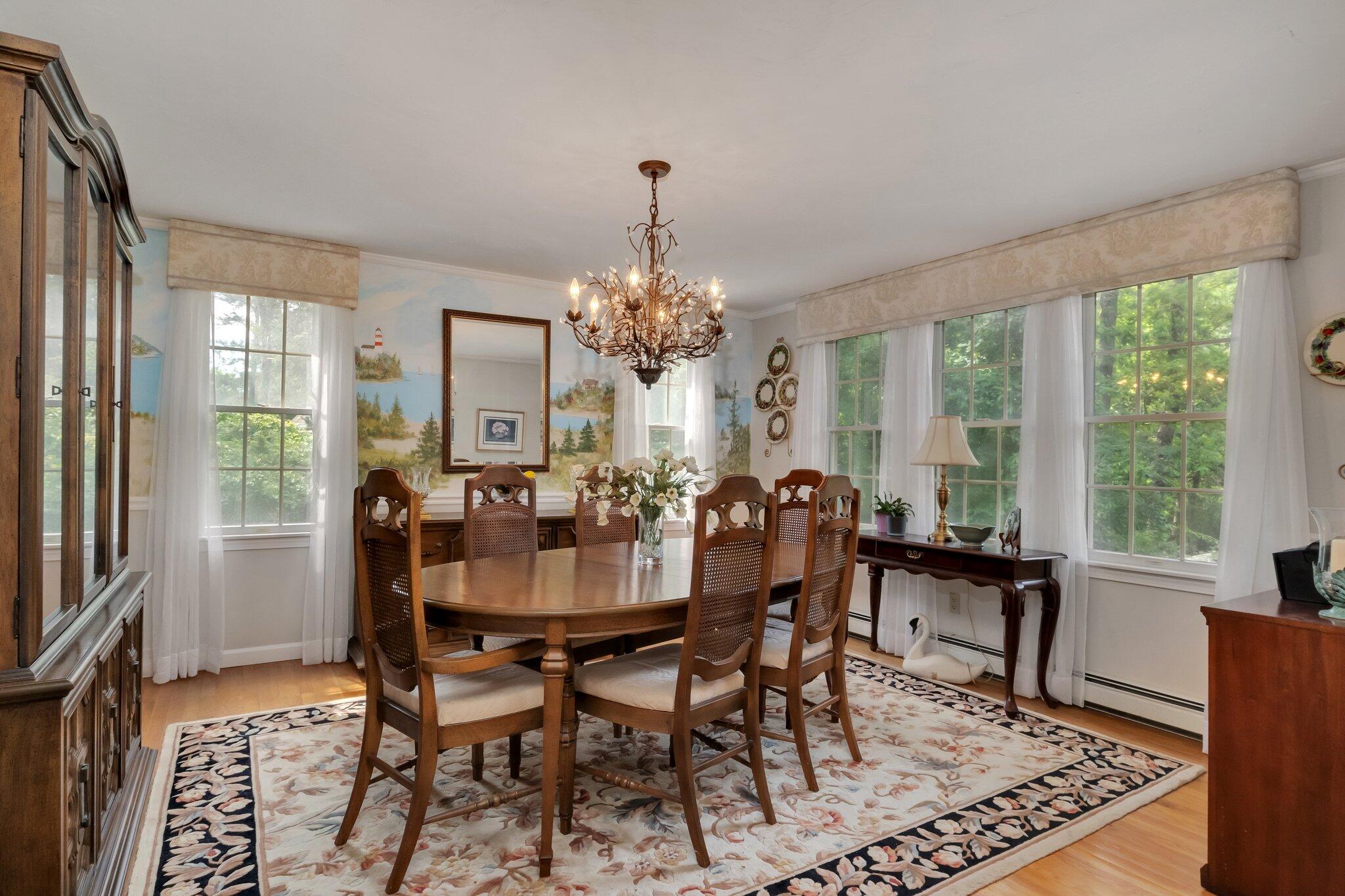 107 Clipper Way Brewster, MA 02631 - Photo 10 of 60 a view of a dining room with furniture window and wooden floor
