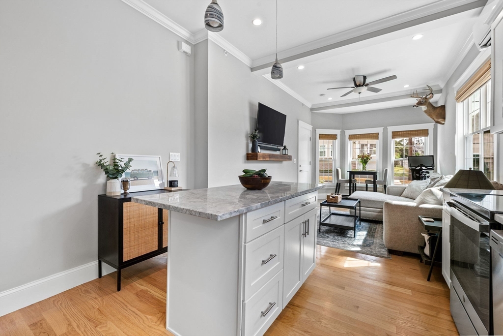 127 Marblehead Street, Unit A North Andover, MA 01845 - Photo 12 of 30 a large white kitchen with a large window
