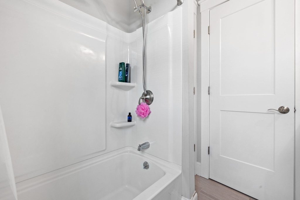 127 Marblehead Street, Unit A North Andover, MA 01845 - Photo 17 of 30 a bathroom with a bathtub and a shower