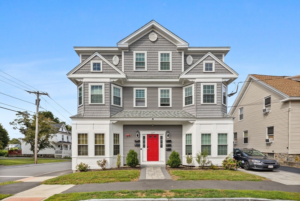 127 Marblehead Street, Unit A North Andover, MA 01845 - Photo 2 of 30 a front view of a house with a yard