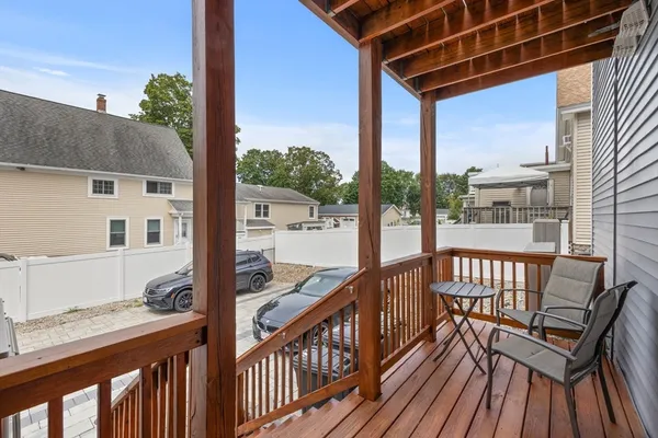 a view of a balcony with wooden floor