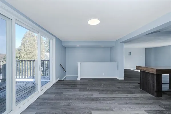 a view of entryway with wooden floor