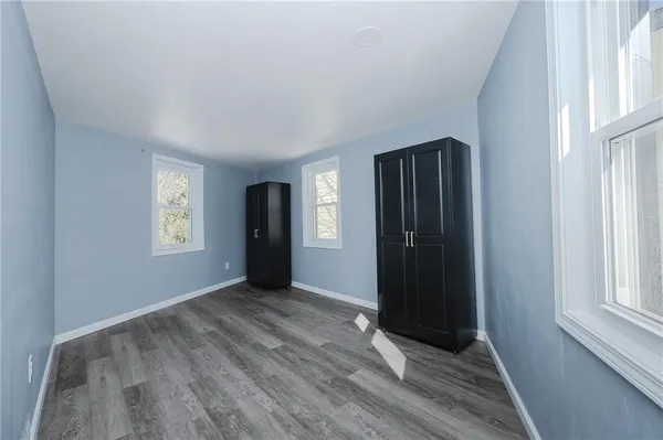 an empty room with closet area