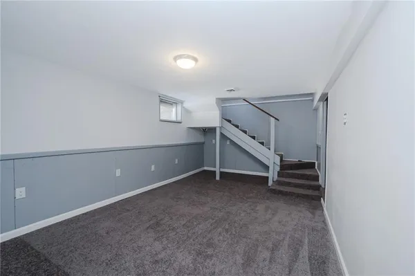 a view of an empty room with stairs