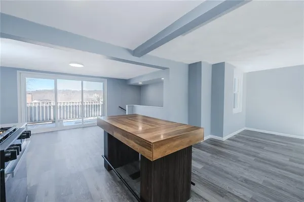 a view of kitchen and wooden floor