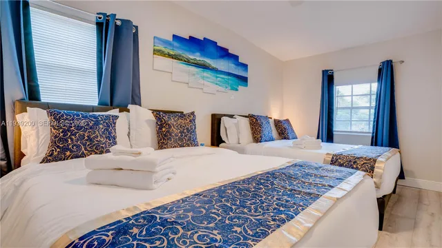 a bedroom with a large bed and a dresser