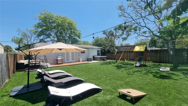 a backyard of a house with seating space