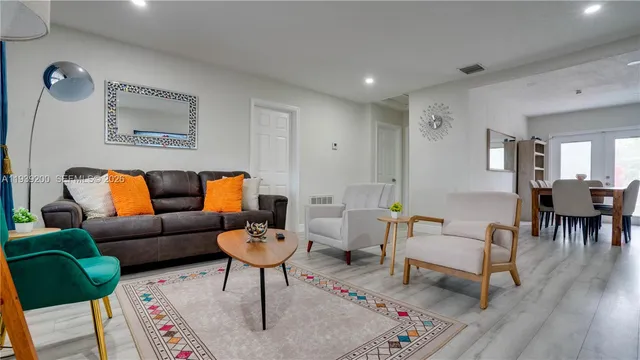 a living room with furniture and a rug