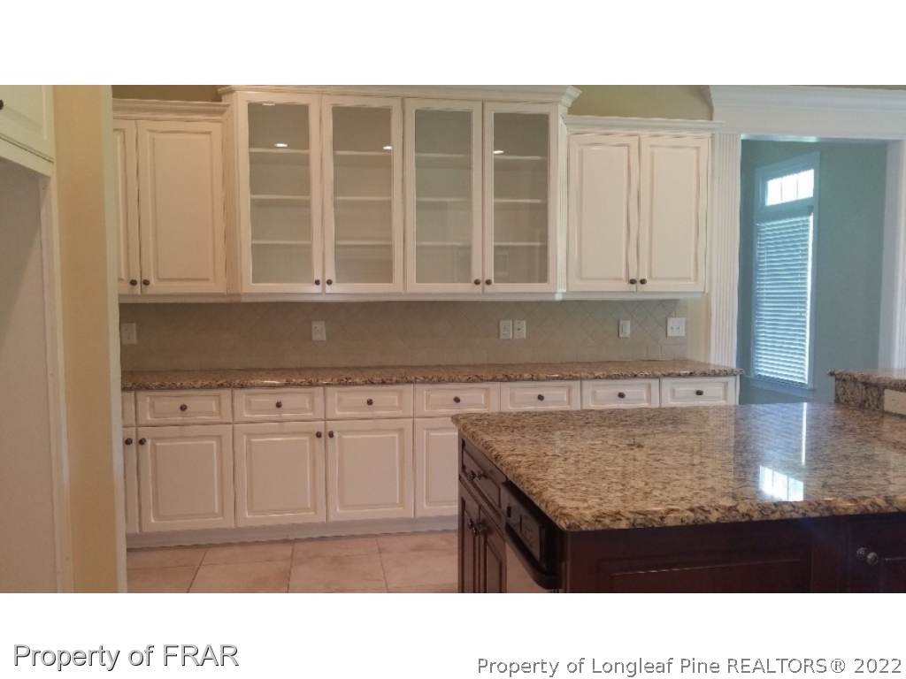 525 Rob Road Stedman, NC 28391 - Photo 15 of 23 a kitchen with a sink window and cabinets