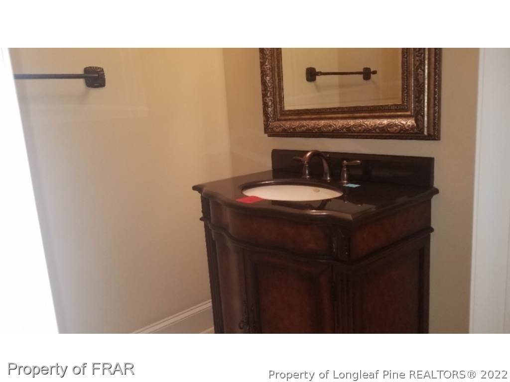 525 Rob Road Stedman, NC 28391 - Photo 8 of 23 a bathroom with a sink vanity and mirror