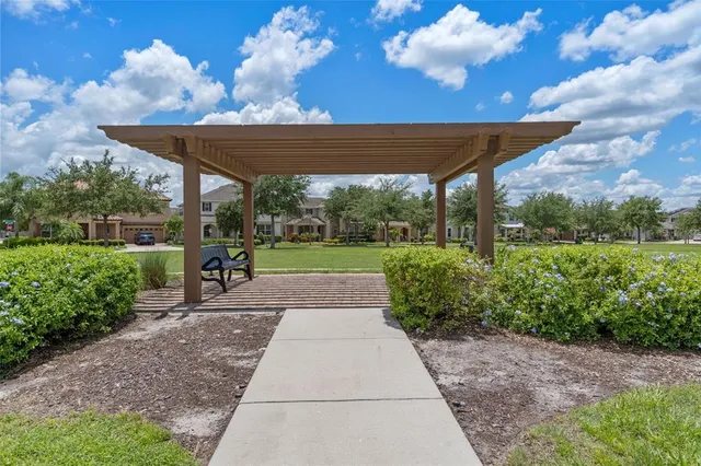 a view of a backyard with pathway