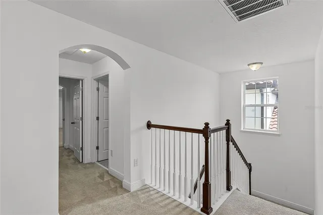 a view of a hallway with windows