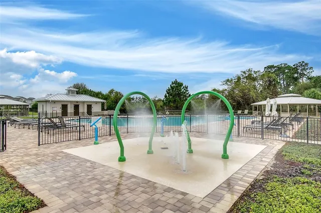 a view of a swimming pool with a patio