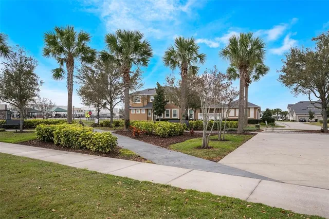 a view of a park that has a street sign on the side