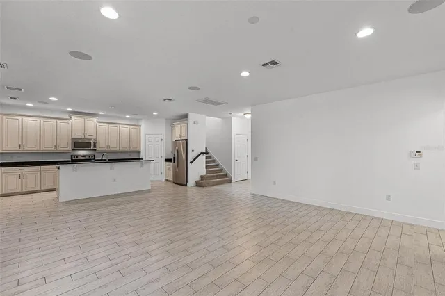 a view of kitchen with a sink and a stove top oven