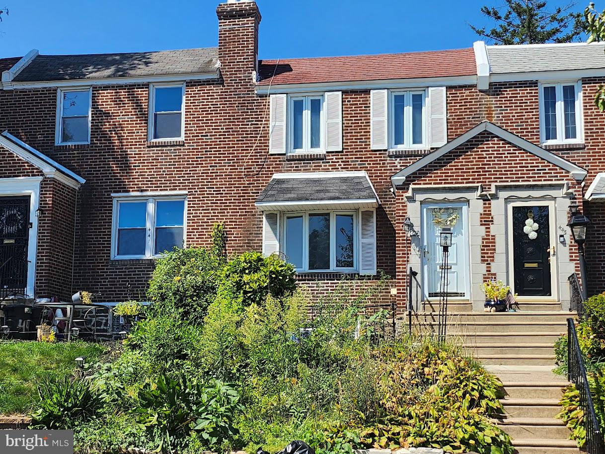 443 Pleasant Street Philadelphia, PA 19119 - Photo 6 of 13 a front view of a house with a yard