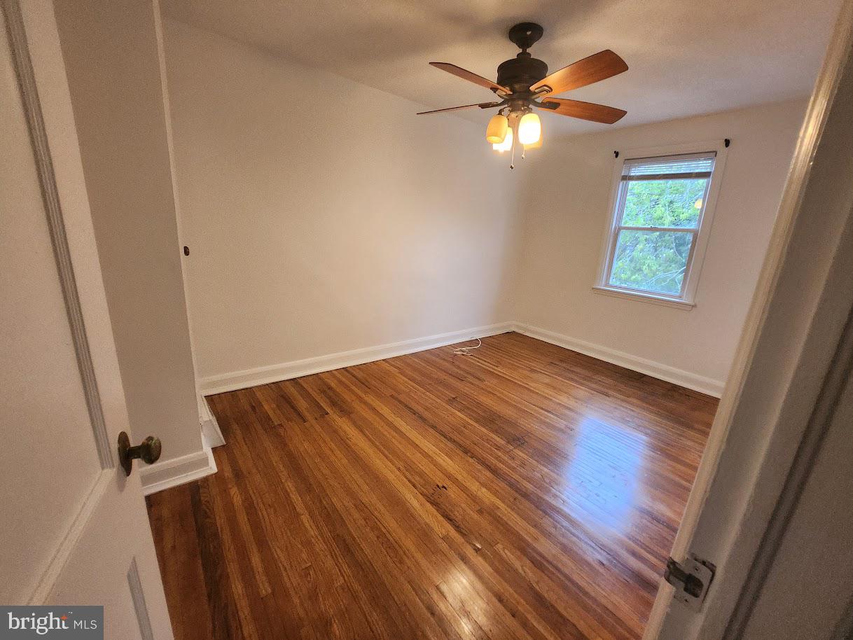 443 Pleasant Street Philadelphia, PA 19119 - Photo 9 of 13 wooden floor in an empty room with a window
