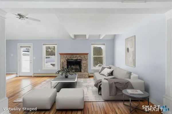 a living room with furniture and a fireplace