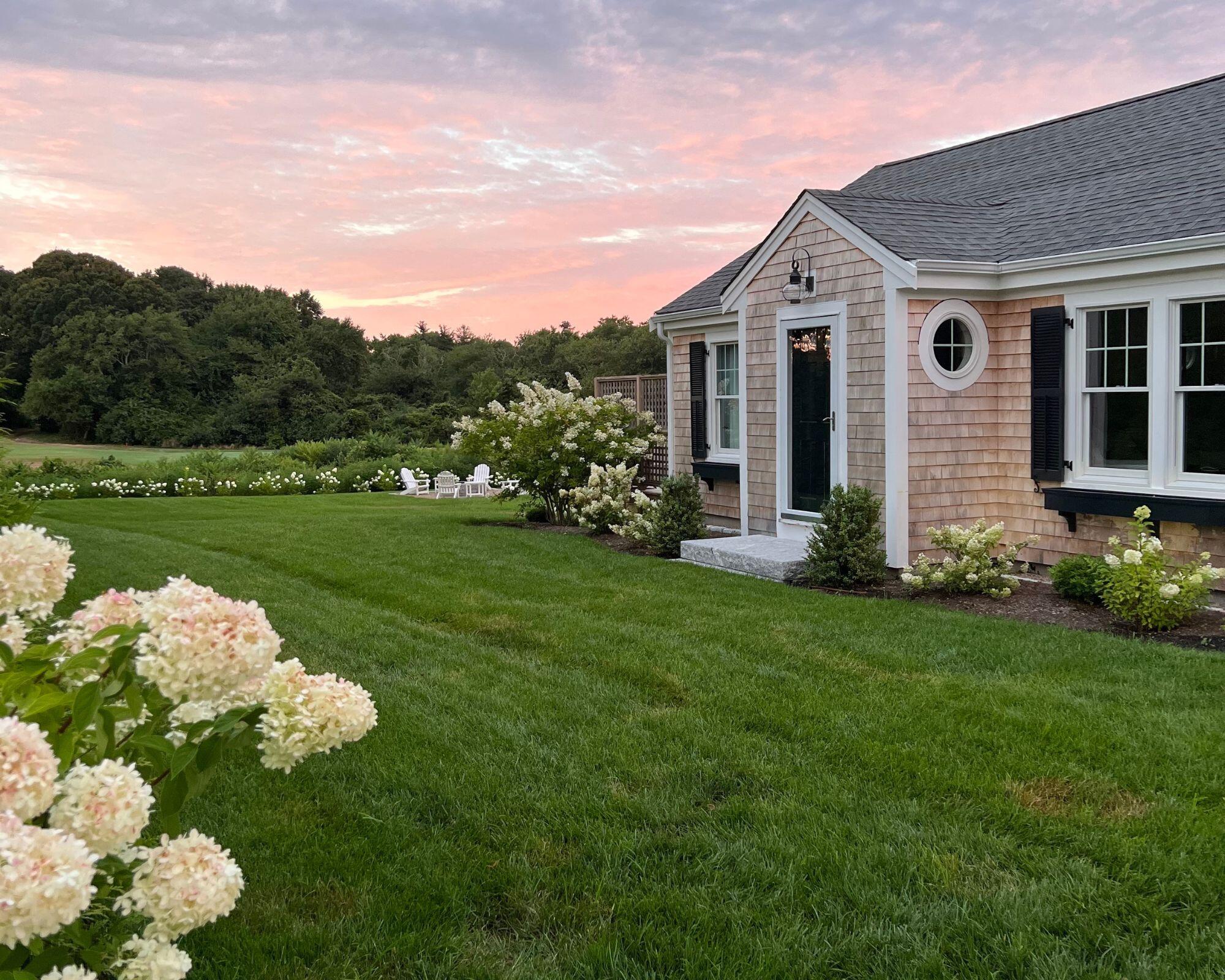 a front view of a house with garden