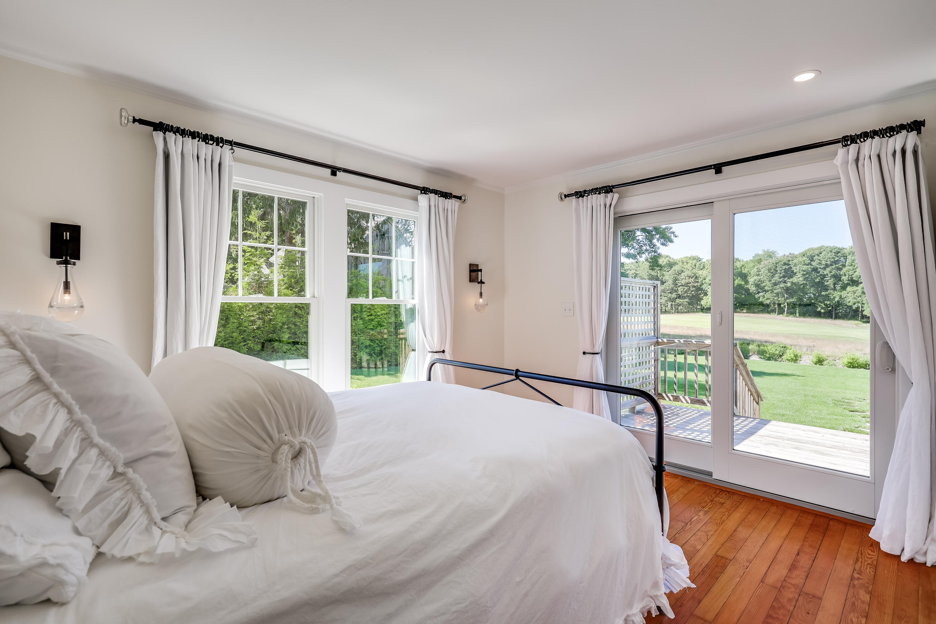 38 Crosby Circle Osterville, MA 02655 - Photo 15 of 28 a large bed sitting in a bedroom next to a large window