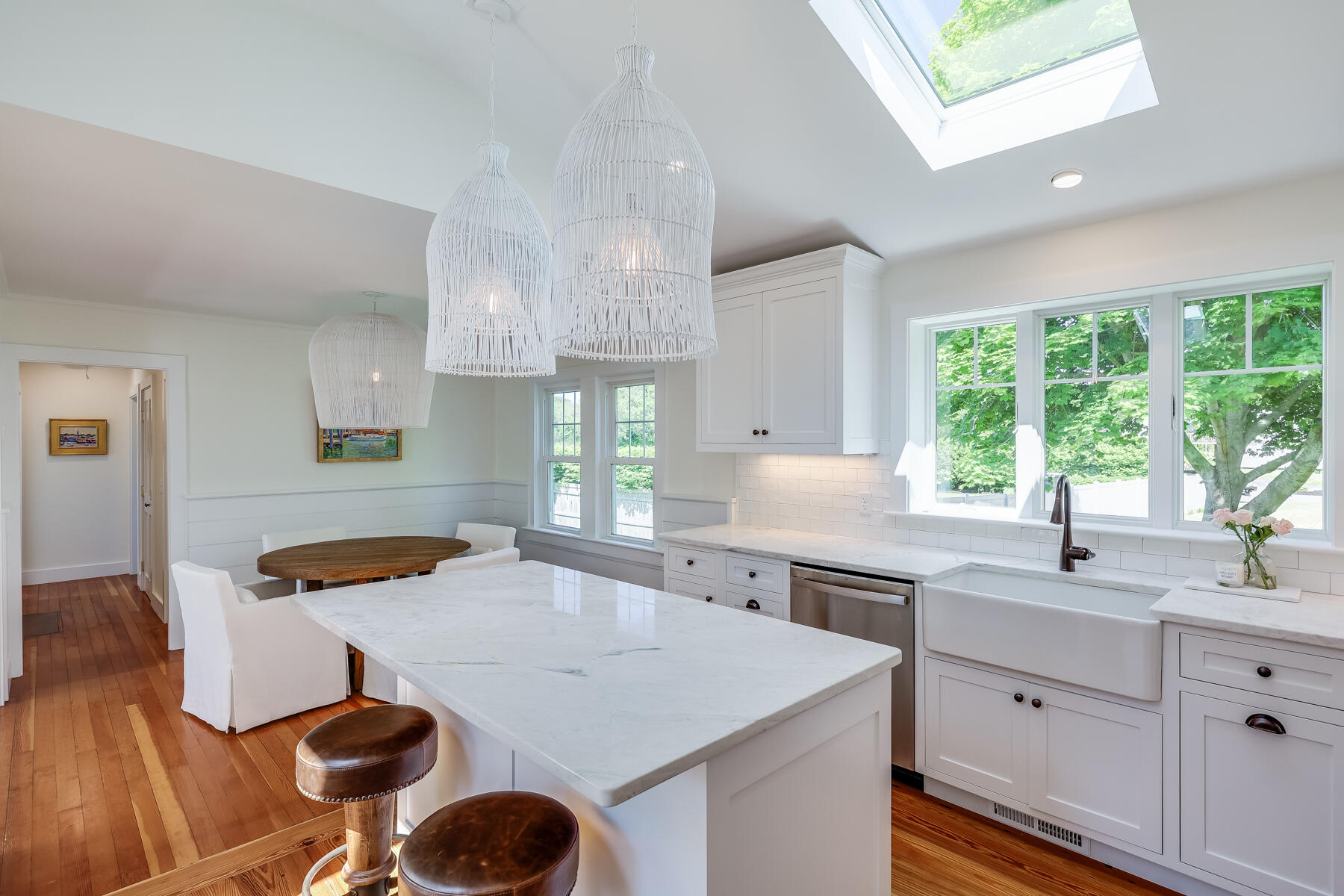 38 Crosby Circle Osterville, MA 02655 - Photo 9 of 28 a kitchen with stainless steel appliances kitchen island granite countertop a sink a stove a dining table and chairs