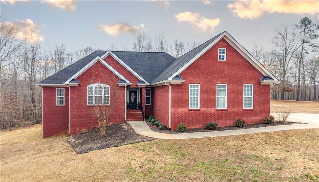 a front view of a house with a yard