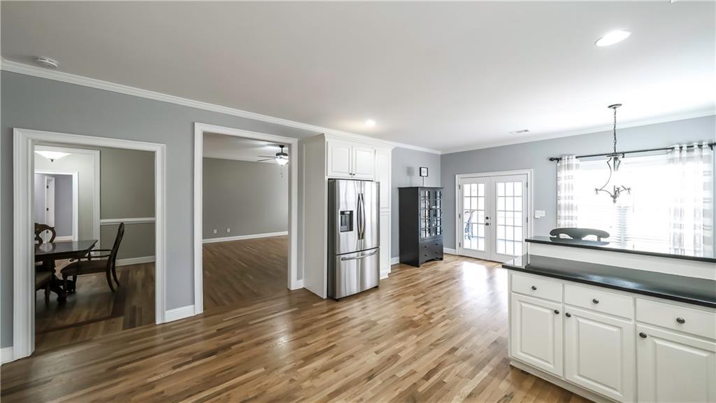 896 Winn Road Douglasville, GA 30134 - Photo 12 of 64 a large kitchen with a lot of counter space and wooden floor