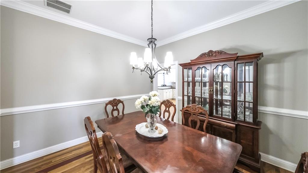896 Winn Road Douglasville, GA 30134 - Photo 17 of 64 a view of a dining room with furniture window and wooden floor