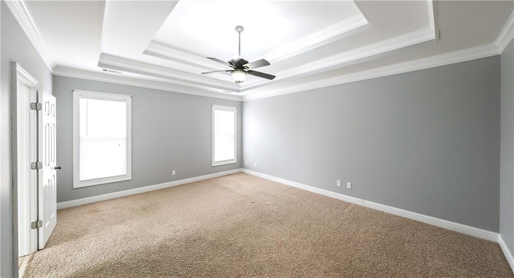 896 Winn Road Douglasville, GA 30134 - Photo 21 of 64 an empty room with windows and fan