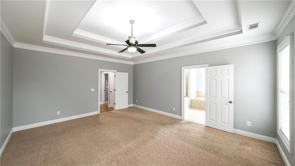 896 Winn Road Douglasville, GA 30134 - Photo 22 of 64 a view of an empty room with a chandelier fan