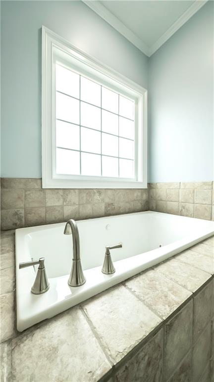 896 Winn Road Douglasville, GA 30134 - Photo 25 of 64 a view of a bath tub sitting in a bathroom