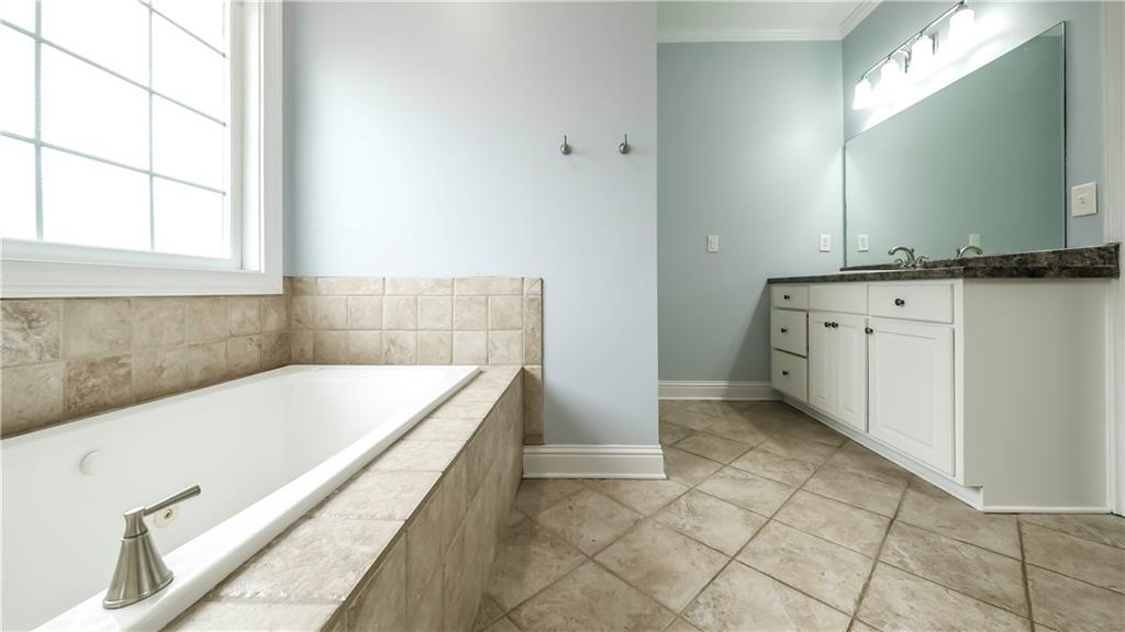 896 Winn Road Douglasville, GA 30134 - Photo 27 of 64 a bathroom with a bathtub and a sink